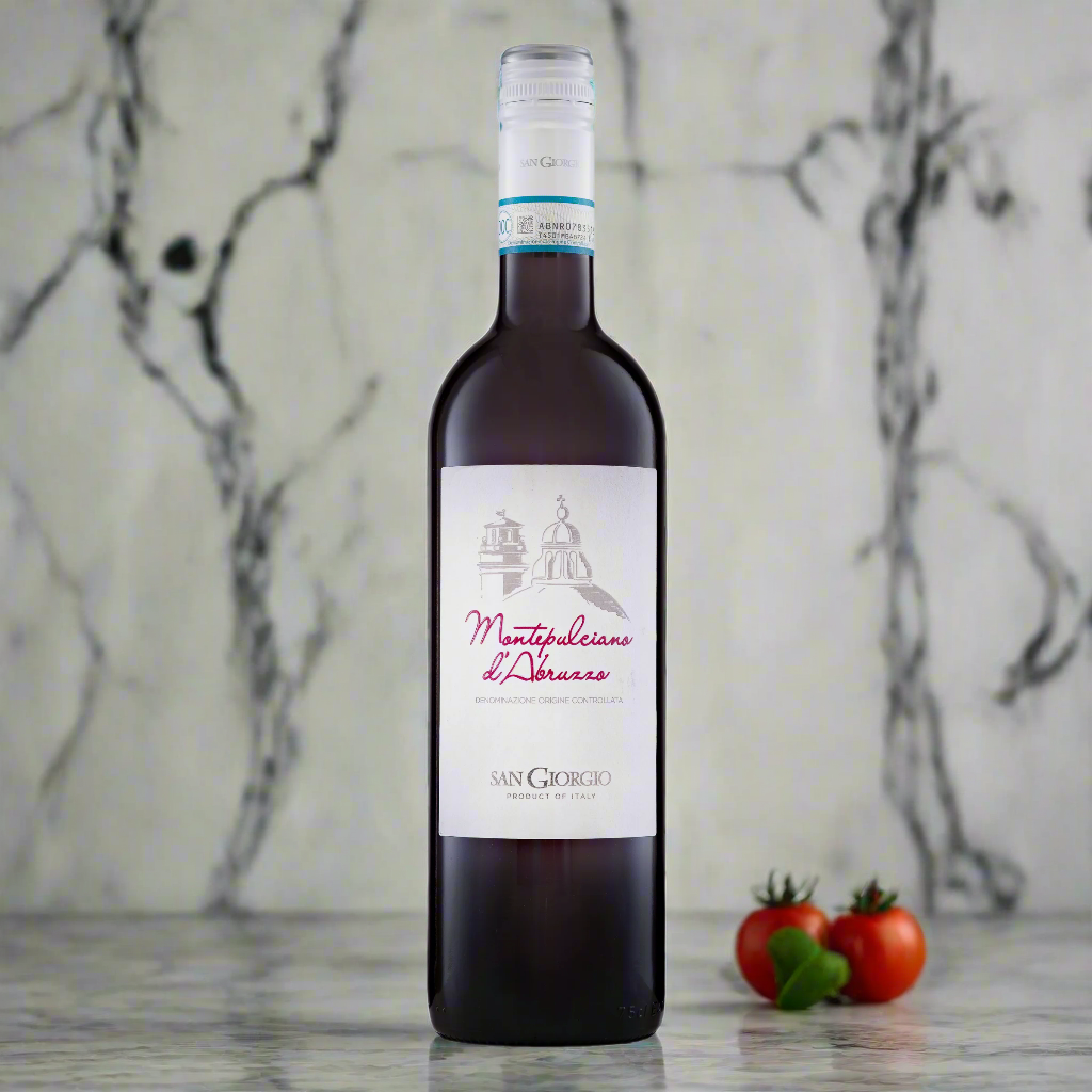 San Giorgio Montepulciano d’Abruzzo on marble kitchen counter with fresh Italian ingredients.