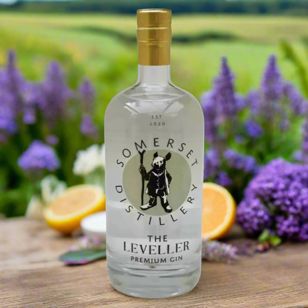 English Countryside Garden with Herbs
A peaceful garden scene with rosemary, sage, and lavender growing nearby, a vintage table set with a G&T, citrus slices, and a small vase of wildflowers. Rolling Somerset hills fade softly in the background—perfect for expressing the gin’s botanical roots and local charm.