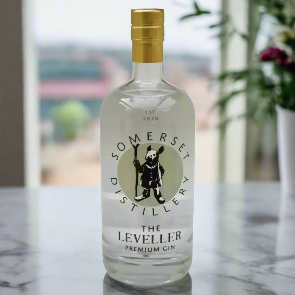 Somerset Distillery The Leveller Premium Gin bottle on marble counter with modern kitchen backdrop
