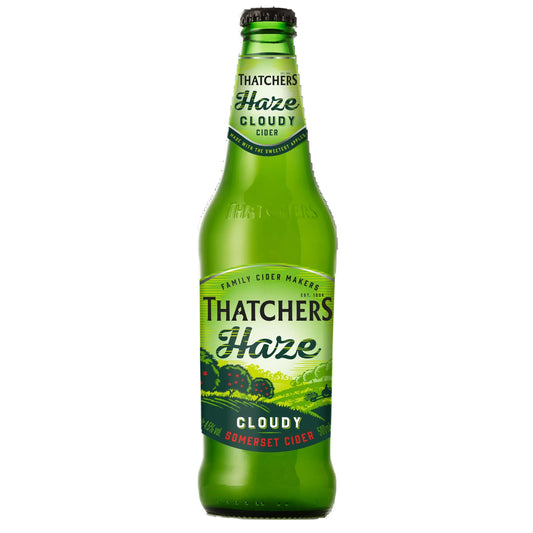 Green bottle of Thatchers Haze cloudy cider on a white background