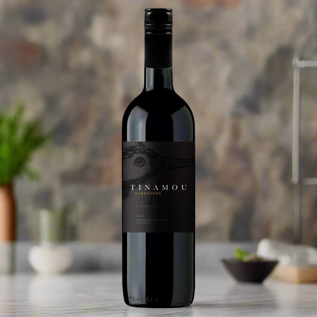 Tinamou Carmenere bottle on kitchen counter with herbs and soft natural light