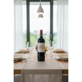 Anseillan from Chateau Lafite Rothschild displayed on a contemporary dining table with elegant glassware and natural daylight.