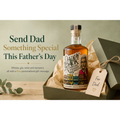 Bottle of Daddy Pack Tennessee Straight Whiskey in a gift box with a tag on a wooden surface.